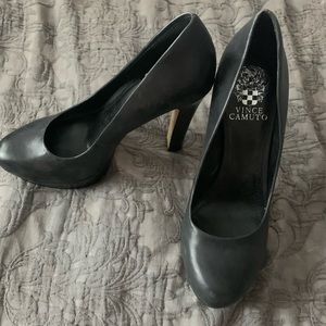 Black leather pumps